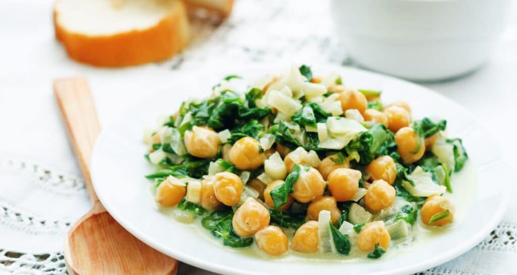Chickpea salad with greens for a balanced athlete meal at lunch